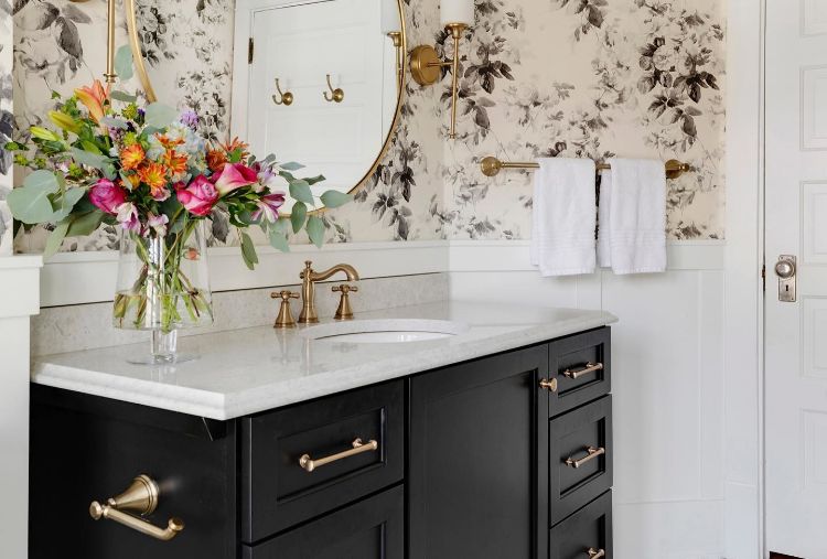 floral bathroom with champagne bronze fixtures
