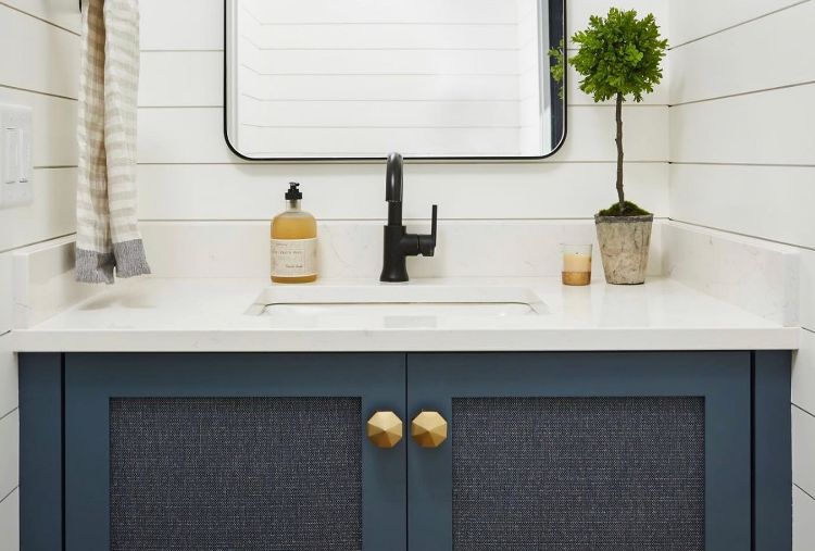 light bathroom with matte black faucet