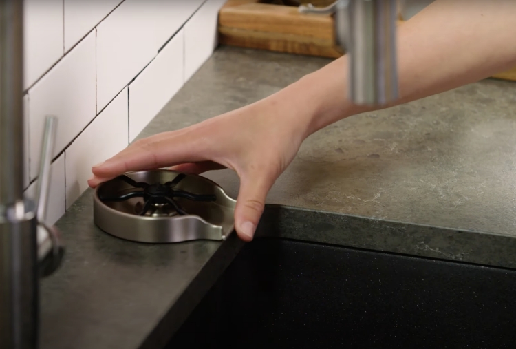 placing glass rinser into countertop