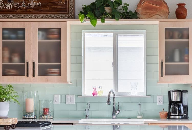 @abdltd's kitchen with light blue backsplash