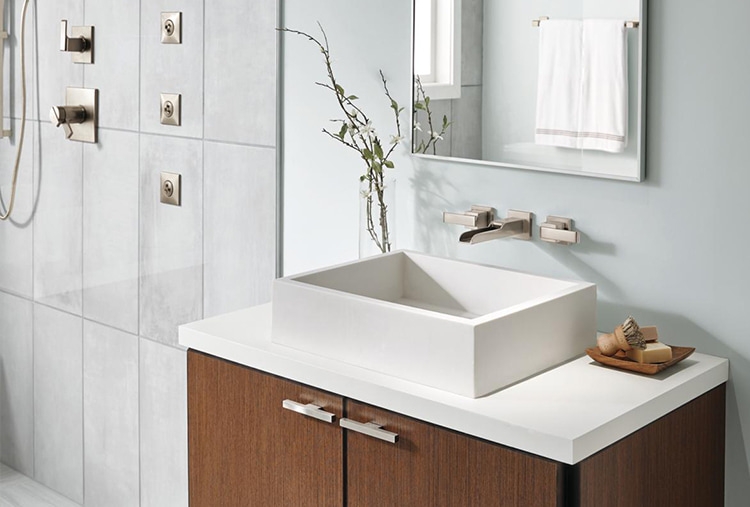 wooden vanity with square sink and wall mount faucet