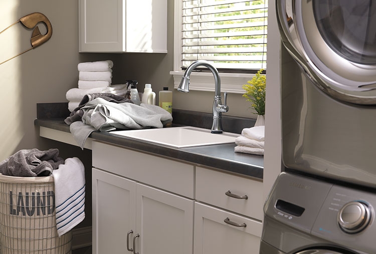 laundry room with stacked washer dryer