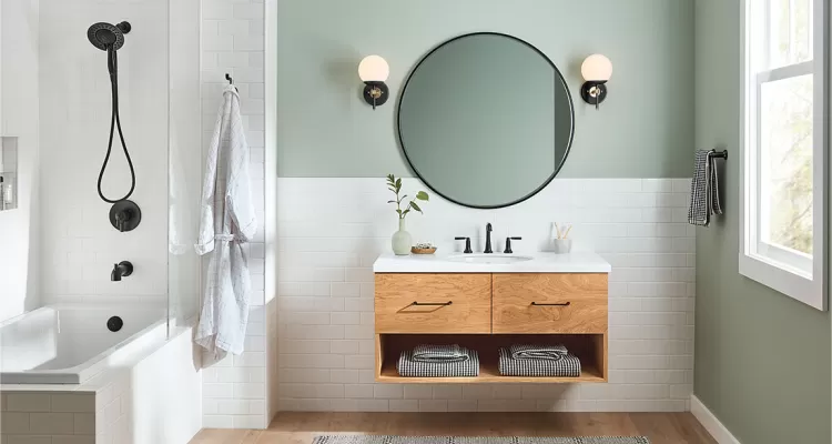light bathroom with two in one shower and circle mirror