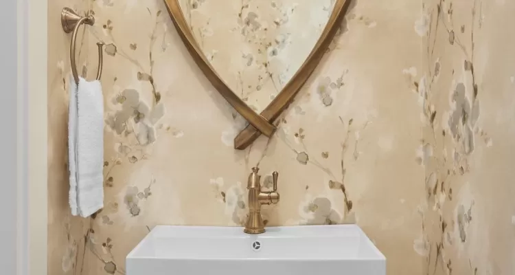 Refreshed powder room with faucet in champagne bronze finish