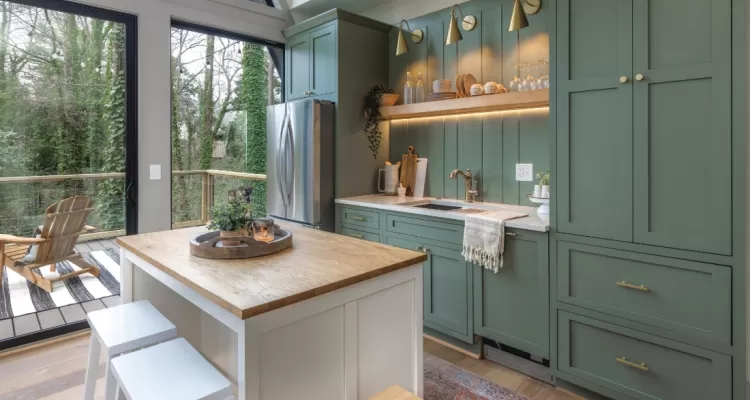 beautiful kitchen with green cabinets