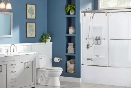 bright blue bathroom with acrylic shower