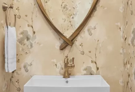 Refreshed powder room with faucet in champagne bronze finish