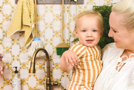 @houselarsbuilt and their chilld in their udpated laundry room