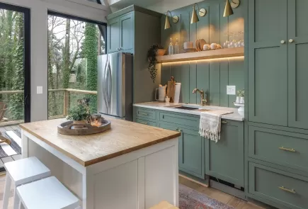 beautiful kitchen with green cabinets